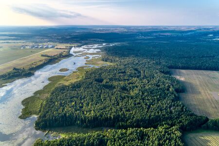 Beautiful aerial shot of a large forest lake.