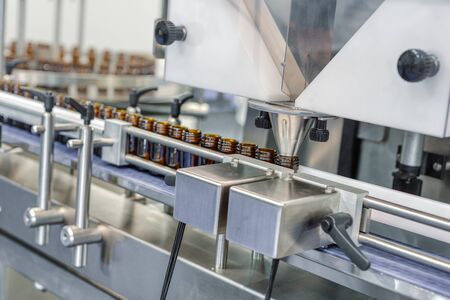 Automatic machine for filling ampoules and vials. Modern pharmaceutical equipment.の写真素材