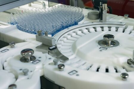Automatic machine for filling ampoules and vials. Modern pharmaceutical equipment.の写真素材