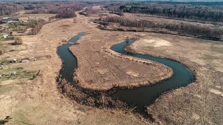 River bend in the shape of a horseshoe. The view from a great height. Early spring, landscape with...