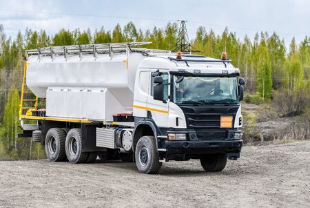 Special vehicle for transporting water and other technical fluids. Machines for the operation of mines and factories for the extraction of minerals.の写真素材