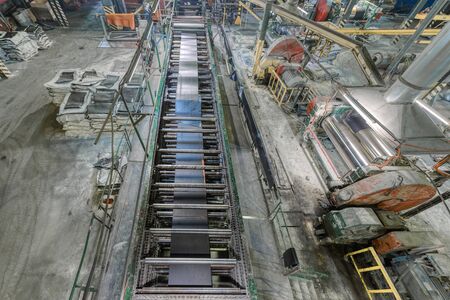 Interior of a factory for manufacturing rubber conveyor belts.