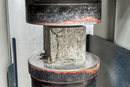 Concrete cube after a compressive strength test. The test sample cracked.の写真素材