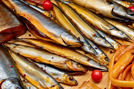 A variety of smoked fish. Beautiful fish showcase. Delicious seafood.
