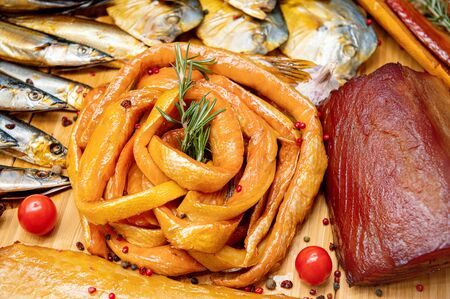 Smoked pink salmon. Beautiful cheese showcase.の写真素材