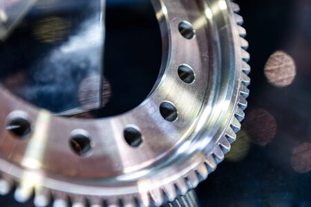 Fragment of a gear wheel closeup shot. Spur gear.