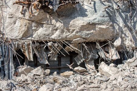 Fragments of the destroyed building. Fragments of concrete walls and foundations.
