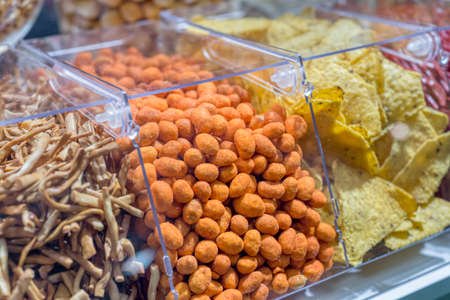 A variety of cheese balls on a store window.の写真素材