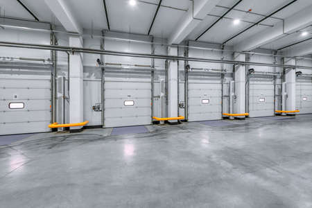 Loading gates of a large industrial warehouse. Industrial interior.
