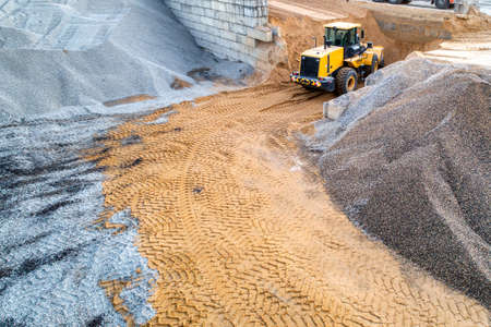 Precast concrete plant. A platform for unloading inert materials from freight railway cars. Crushed stone unloading.の写真素材