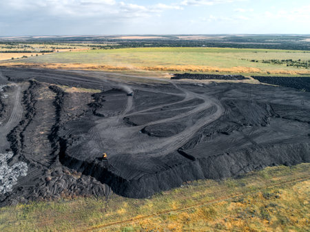 Large warehouse with a mound of coal. Aerial view.