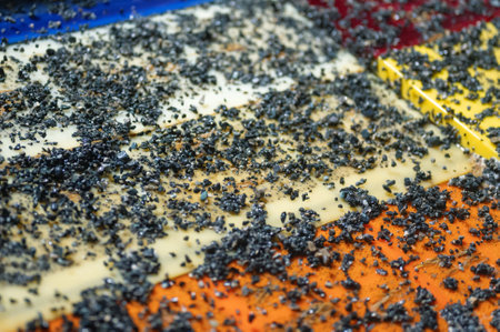 Vibrating screen, ore washing with liquid. Lots of small stones on the surface of the sieveの写真素材
