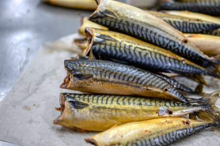 Lots of smoked mackerel carcasses. The fish is in a bunch.の写真素材