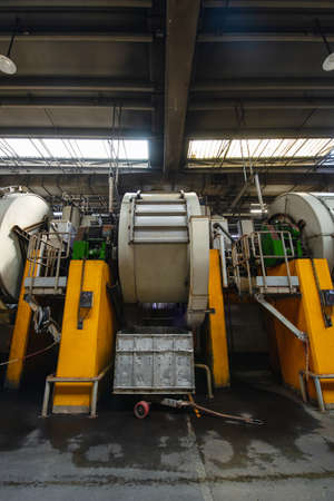Tannery. Large metal barrels for leather dyeing