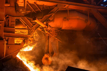 The process of tapping molten metal and slag from a blast furnace.の写真素材