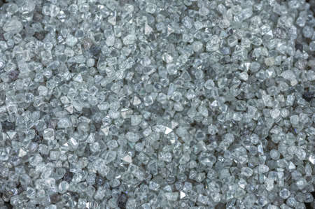 A scattering of various diamonds. Abstract background. Uncut gems, natural shape