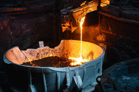 Liquid molten metal is poured into the ladle.