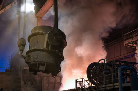 The metallurgical bucket hangs on a special crane beam