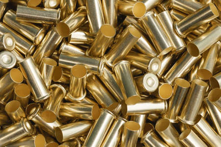 Pile of golden shells of bullets as background close view