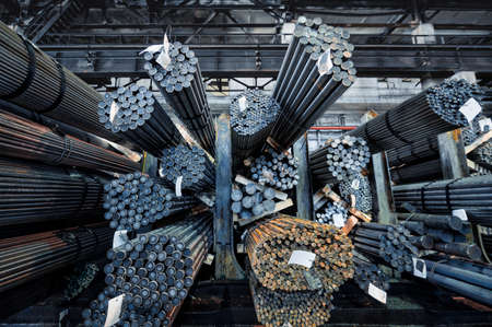 Rolled metal warehouse. Many packs of metal bars on the shelvesの写真素材