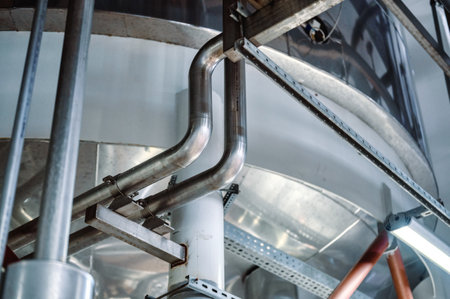 Sophisticated steel piping system under the bottom large tank.の写真素材
