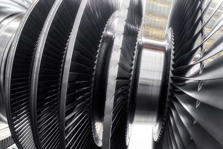 Shaft with numerous blades of modern steam turbine at plant