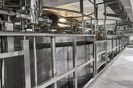 Metal ground near large cisterns for fermented milk productsの写真素材