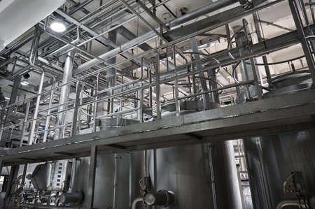 Metal ground near large cisterns for fermented milk products
