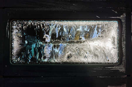 An ingot of silver lies in a graphite mold.の写真素材