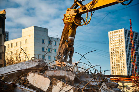 Hydraulic concrete crusher breaks and crushes reinforced concrete.の写真素材