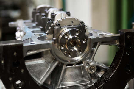 Cylinder block complete with crankshaft. Assembly line of internal combustion engines.