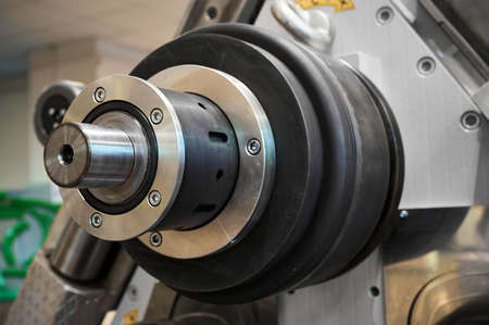 Machine rollers tool with steel industrial rolls in workshop of metalwork factory closeup. Equipment...