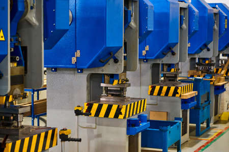 Punching press machine tools make metal details in workshop