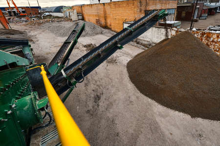 Mobile crushing and sorting complex works among soil piles