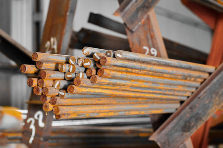 Round steel section rolling profile with marking in storageの写真素材