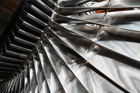 Shiny blades of high-speed steam turbine in workshopの写真素材