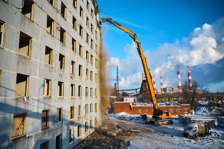Building dismantling with high-altitude excavator destroyerの写真素材