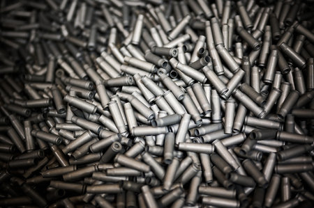 Bullet casings heap as background black and white effectの写真素材
