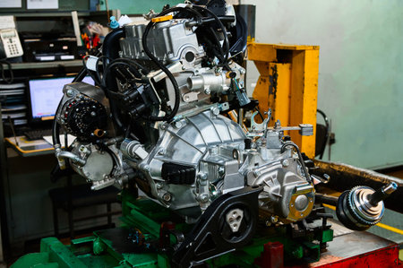 Engine installing in car compartment in assembling workshop