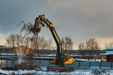 Hydraulic shears on excavator remove concrete and metalの写真素材