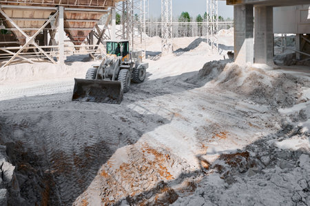 Wheel loader operates at industrial plant of calx production