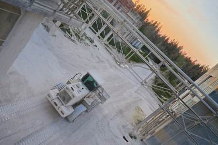 Wheel loader transports lime products in bucket at plant