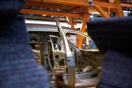 Car body transported by hanging conveyor in plant workshopの写真素材