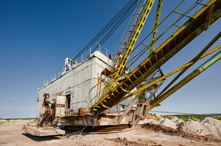Huge dragline with hoist mines mineral deposits in quarryの写真素材