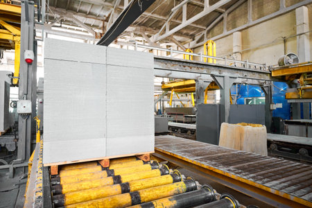 Stack of finished blocks on roller conveyor at plant