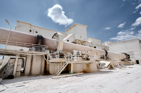 Tubular rotary furnace and smoking chimney at factoryの写真素材