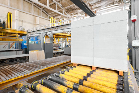 Stack of finished blocks on roller conveyor at plant