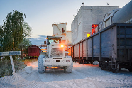 Wheel loader loads limestone into freight gondola cars