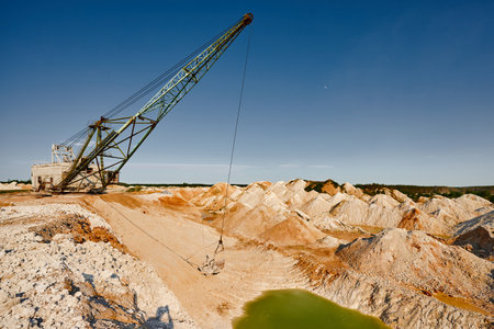 Old dragline mines minerals in chalk quarry on sunny dayの写真素材
