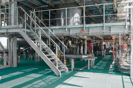 Industrial chemical plant with pipelines and stair access showcasing operational infrastructure